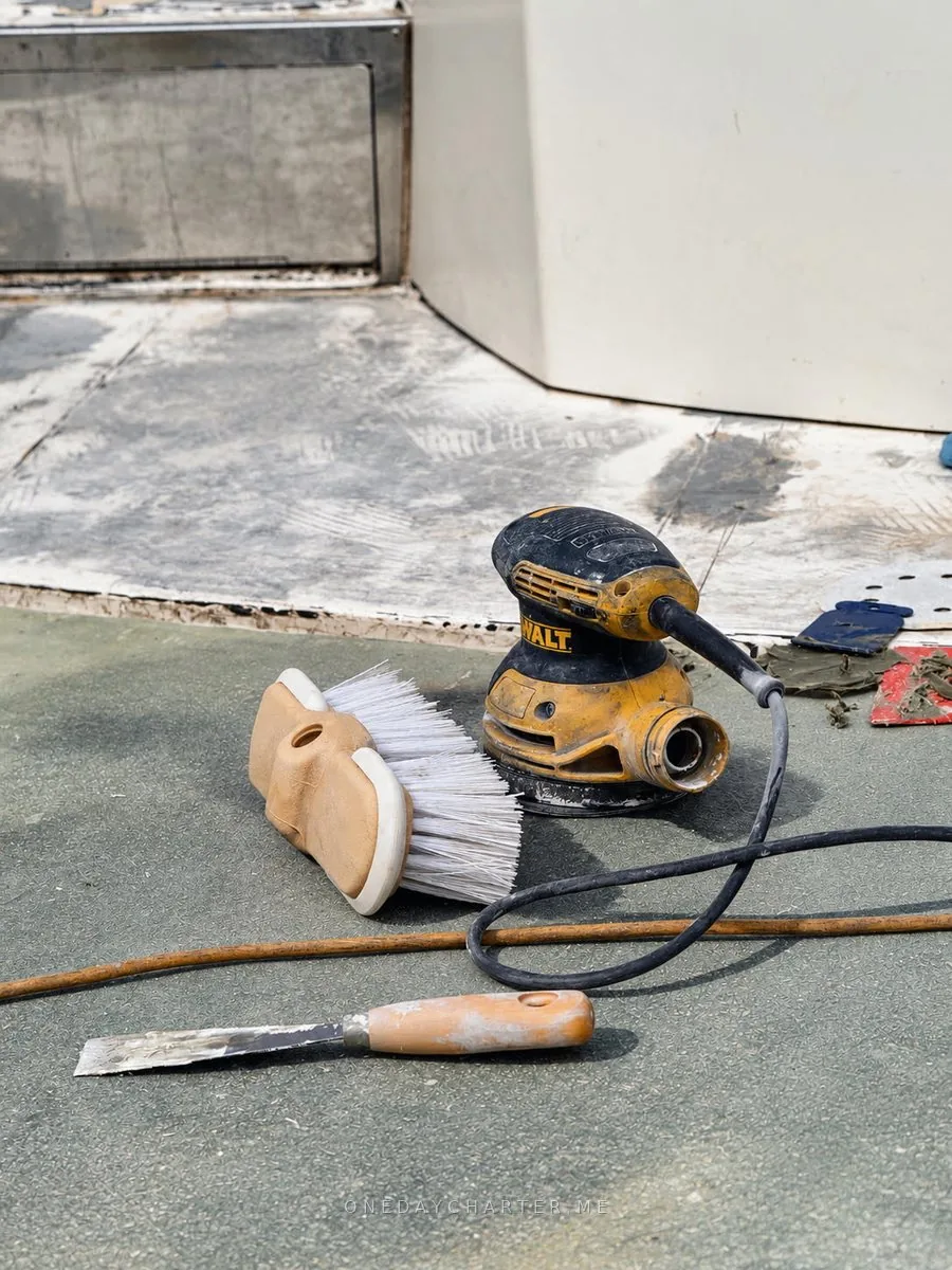 Sanding and cleaning tools on deck - One Day Charter boat care
