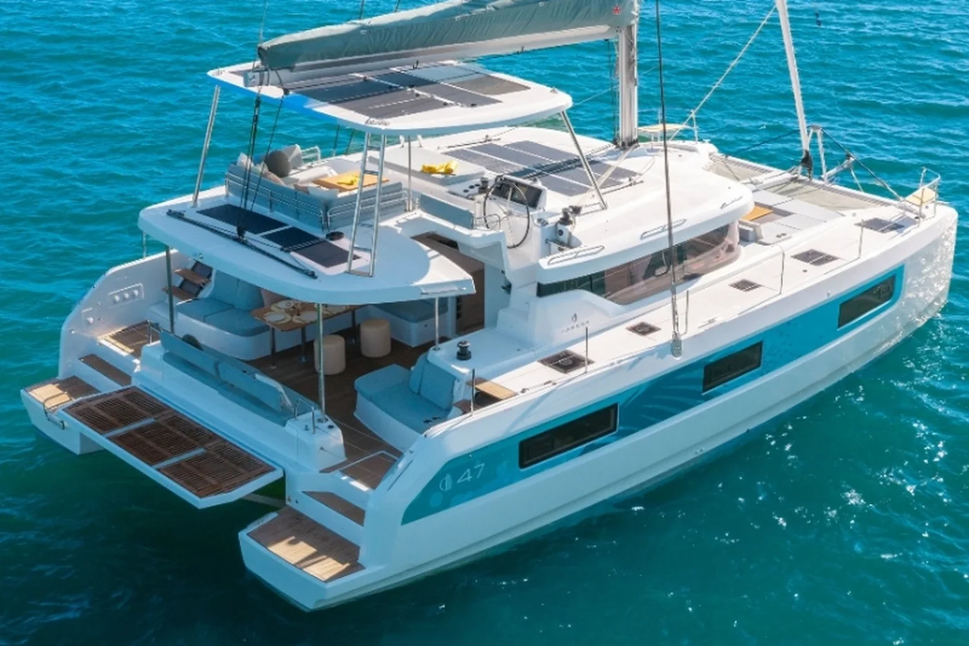 The Lagoon 47 catamaran at anchor, seen from above, with the flybridge and the forward cockpit in view