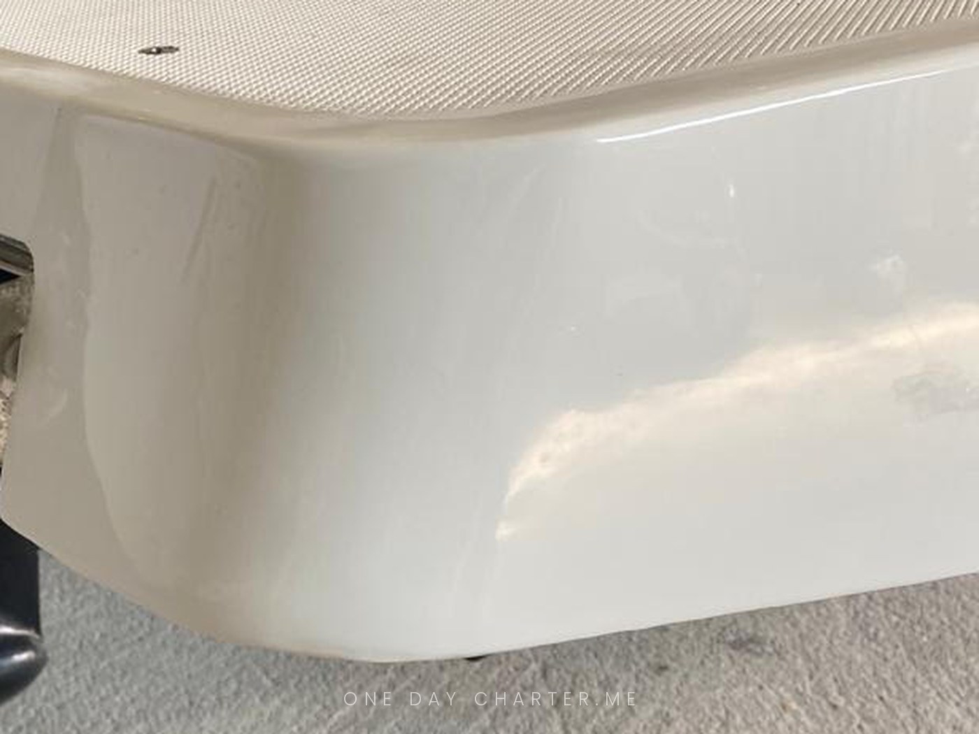 The same corner after the gelcoat repair, smooth and glossy