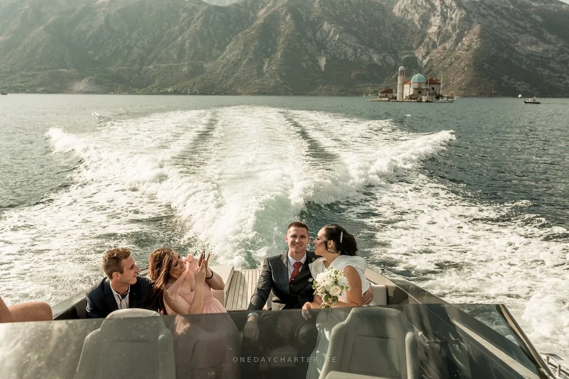 Nevena & Marko on the boat with Our Lady of the Rocks behind them